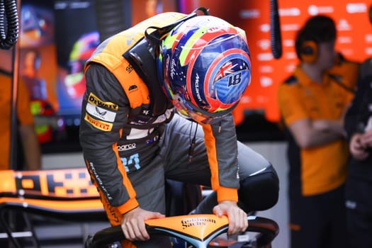 MELBOURNE, AUSTRALIA - MARCH 31: Oscar Piastri of Australia gets into the McLaren MCL36 during practice in the 2023 Australian Grand Prix at Albert Park in Melbourne, Australia