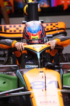 MELBOURNE, AUSTRALIA - MARCH 31: Oscar Piastri of Australia gets into the McLaren MCL36 during practice in the 2023 Australian Grand Prix at Albert Park in Melbourne, Australia