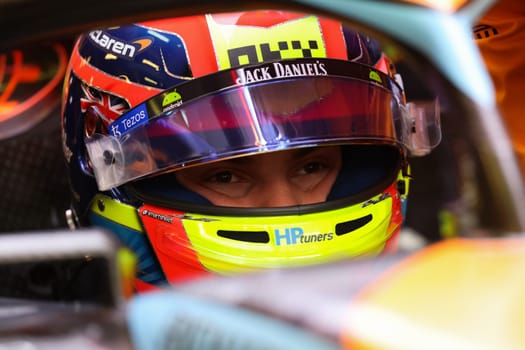 MELBOURNE, AUSTRALIA - MARCH 31: Oscar Piastri of Australia gets into the McLaren MCL36 during practice in the 2023 Australian Grand Prix at Albert Park in Melbourne, Australia