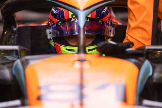 MELBOURNE, AUSTRALIA - MARCH 31: Oscar Piastri of Australia gets into the McLaren MCL36 during practice in the 2023 Australian Grand Prix at Albert Park in Melbourne, Australia