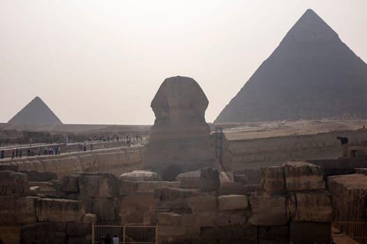 Giza, Egypt - April 13 2008: Sphinx and pyramids (Cheops and Khafre) in the archeological site of Giza. Egypt.