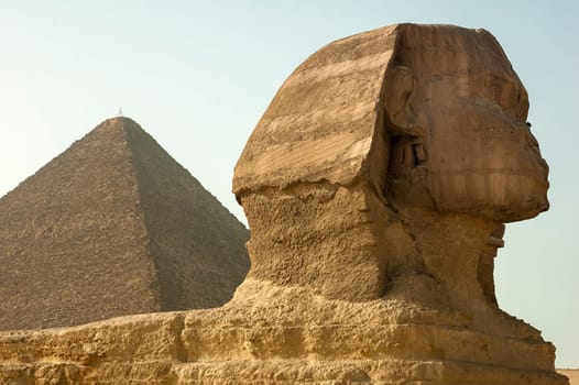 Giza, Egypt - April 13 2008: Sphinx and pyramids (Cheops and Khafre) in the archeological site of Giza. Egypt.