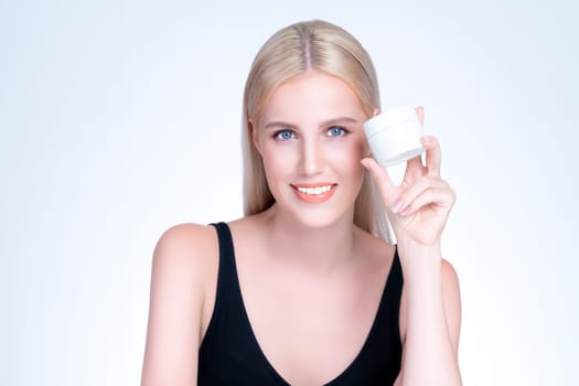 Personable beautiful perfect natural cosmetic makeup skin woman holding mockup jar moisturizer cream for healthy skincare treatment, anti-aging product advertisement in isolated background.