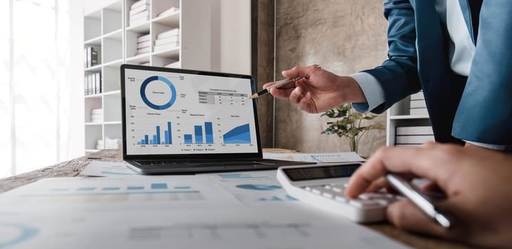 Business financial, accountant discussing with partner are meeting to audit finance planning sales to meet targets set in next year. stock market concept....