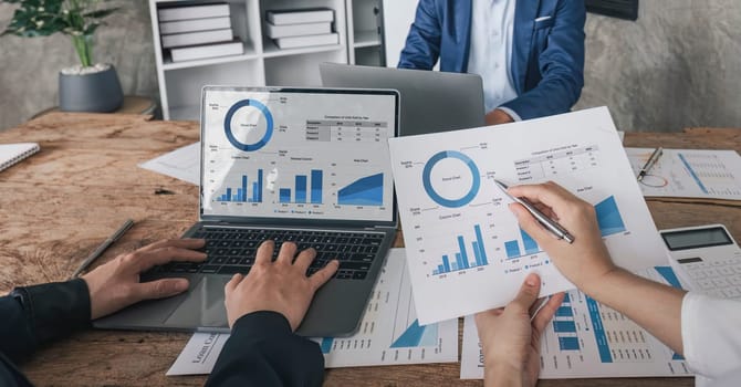 Business financial, accountant discussing with partner are meeting to audit finance planning sales to meet targets set in next year. stock market concept....