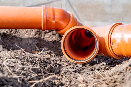 PVC plastic pipe for sewerage in the ground.