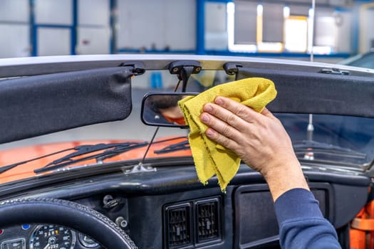manual cleaning of the interior of an old car. High quality photo