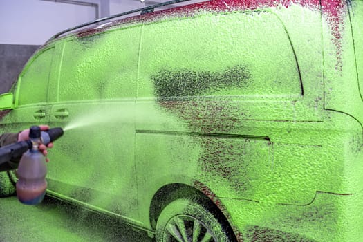 wash cars with green active foam in the garage. High quality photo