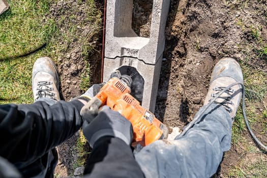 drilling of concrete foundations with an electric drill.