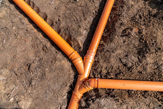 sewage system made of plastic PVC pipes in the ground.