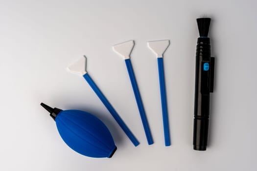 a set for cleaning the chamber from dirt. a purge bag, a mop for cleaning the matrix, a cleaning liquid. white background