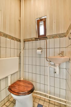 a bathroom with a toilet, sink and mirror on the wall next to it is an open door that leads to a window