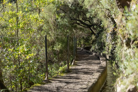 Irrigation canal with hiking path through the mountains at Madeira Island, Portugal