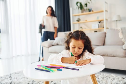 Conception of art. Mother and her daughter spending time together at home.