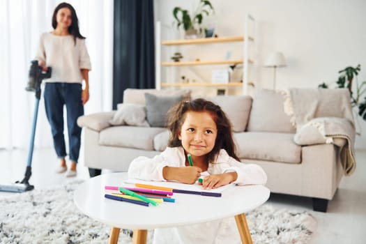 Conception of art. Mother and her daughter spending time together at home.