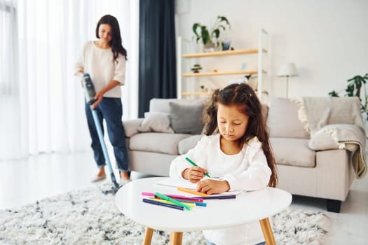 Conception of art. Mother and her daughter spending time together at home.