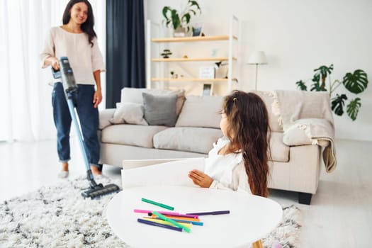 Conception of art. Mother and her daughter spending time together at home.