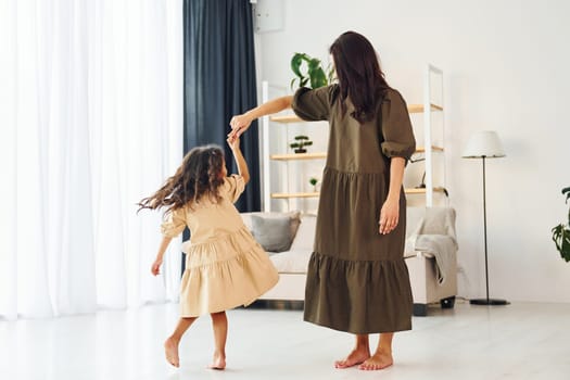 Happy family. Mother and her daughter spending time together at home.