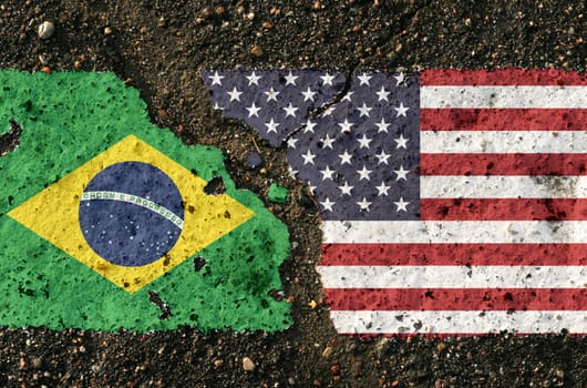 On the pavement there are images of the flags of Brazil and the USA, as a symbol of the confrontation between the two countries. Conceptual image.