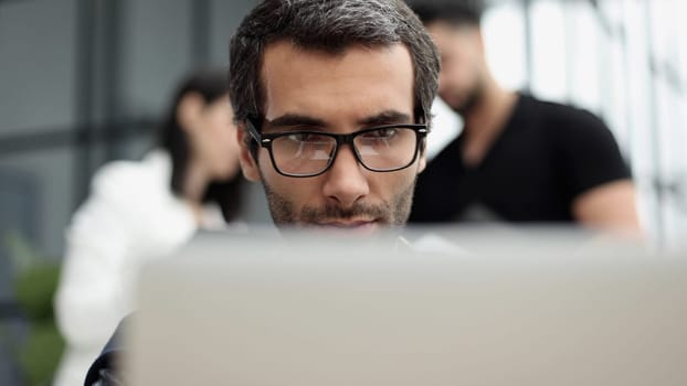 Young man working in a modern office