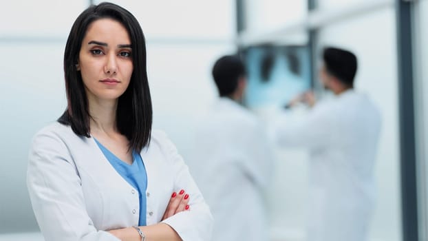 Portrait of a pensive woman doctor in a hospital corridor