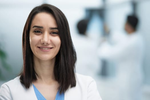 Portrait of a friendly physician woman. Perfect medical service in a hospital. Medicine concept