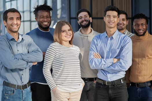 Everybody brings a different skill to the team. Portrait of a diverse group of coworkers standing in an office.