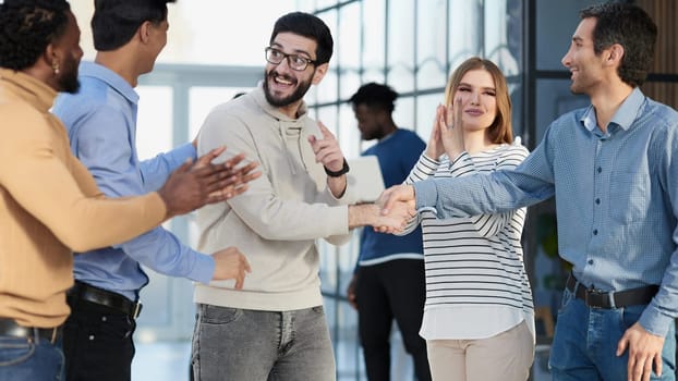 Group of successful architects standing at conference hall at office