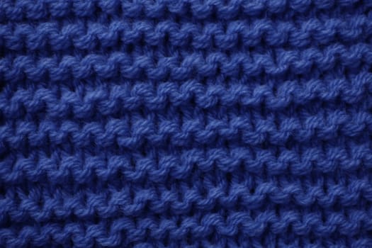 The surface is knitted with blue woolen threads...Abstract background for design with copy space.