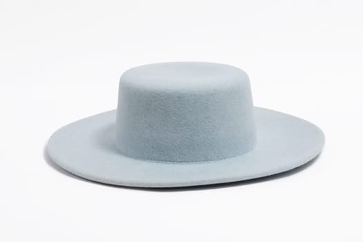 Felt stilish summer blue hat for women, isolated white background.
