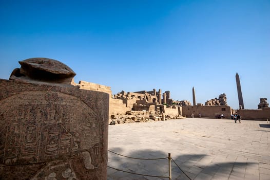 Luxor, Egypt - April 15 2008: Tourists visiting the Temple of Amun in Karnak complex, Luxor, Egypt