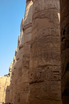 Luxor, Egypt - April 15 2008: Tourists visiting the Temple of Amun in Karnak complex, Luxor, Egypt