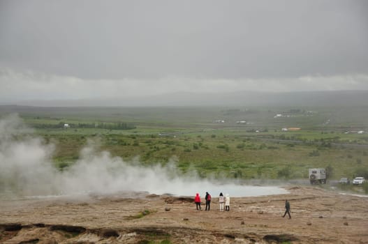 Aerial view of group of people around the Strokkur geyser in Iceland