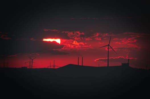 Scenic view of an agricultural field with windmills during a mesmerizing sunsetin the Ruhr area in Germany
