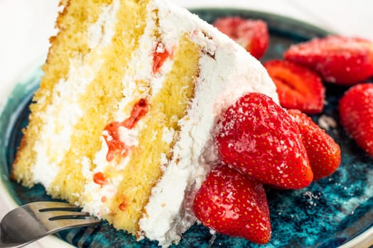 selective focus. festive berry cake. homemade strawberry cake cut. Strawberry pie decorated with fresh strawberries stands on a plate. Ice cream and strawberry cream. Cut off a piece.