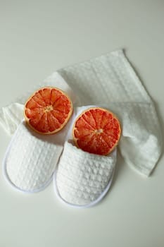 pattern, fabric shoes, dried orange, shower slippers, lies on the table