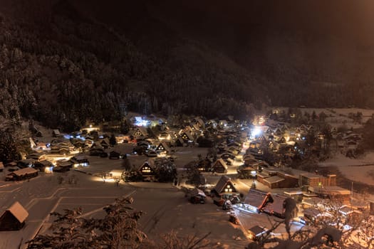 Shirakawa-go's isolated mountain village is a magical place on a snowy night, with its charming houses and beautiful lights.