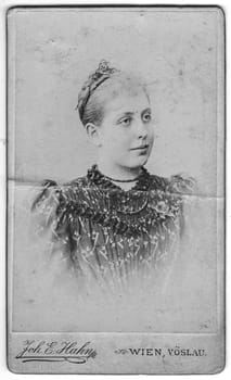 WIEN, AUSTRIA-HUNGARY - CIRCA 1893: Vintage cabinet card shows portrait of mature woman. Edwardian fashion. Photo was taken in a photo studio. Photo was taken in Austro-Hungarian Empire or also Austro-Hungarian Monarchy