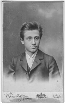 PRAHA-PRAG, AUSTRIA - HUNGARY - CIRCA 1910: Vintage cabinet card shows portrait of the young man. Photo was taken in a photo studio. Photo was taken in Austro-Hungarian Empire or also Austro-Hungarian Monarchy