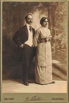 SKUTEC, AUSTRIA-HUNGARY - CIRCA 1910: Cabinet card shows the engaged couple. Photo was taken in Austro-Hungarian Empire or also Austro-Hungarian Monarchy