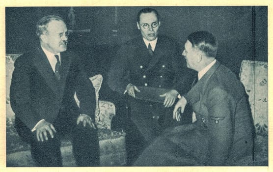 BERLIN - NOVEMBER 12, 1940: Molotov and Hitler in conversation, Counselor Gustav Hilger interprets. Soviet Foreign Minister Vyacheslav Molotov arrives on 12 November 1940 at the Berlin train station at midday. German Foreign Minister Joachim Ribbentrop meets him there and they then sit down for a meeting. They then proceed to the Reich Chancellery, where Molotov meets Adolf Hitler.