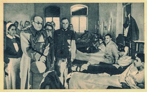 SPAIN - CIRCA 1942: Jose Moscardo visits injured soldiers from the Blue Division.