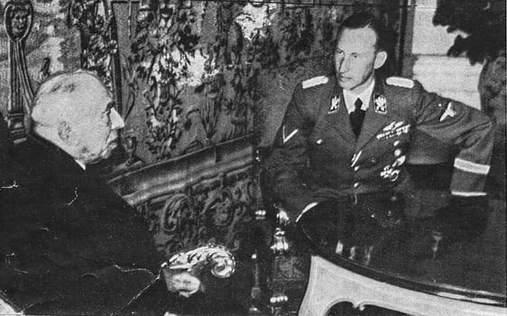 PRAGUE, PROTECTORATE OF BOHEMIA AND MORAVIA - SEPTEMBER 30, 1941: Reinhard Heydrich, Deputy Reich Protector of the Protectorate of Bohemia and Moravia, right, meets Emil Hacha, State President, at the Prague Castle in Prague, Protectorate of Bohemia and Moravia, September 30, 1941