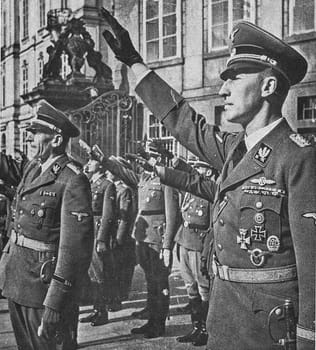 PRAGUE, PROTECTORATE OF BOHEMIA AND MORAVIA - SEPTEMBER 28, 1941: Reinhard Heydrich (right) and K.H. Frank at Prague castle. Nazis salute.