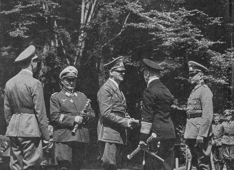 COMPIEGNE, FRANCE - JUN 21, 1940: The meeting of fascist leaders before armistice with Francein Compiegne. From left to right: Deputy Fuhrer Rudlof Hess, Reichsmarschall Hermann Goring, Adolf Hitler, Admiral Erich Raeder and Field Marshal Walter von Brauchitsch.