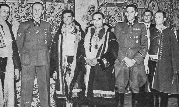 PRAGUE, PROTECTORATE OF BOHEMIA AND MORAVIA - CIRCA 1942: The Deputy Reich Protector Obergruppenf hrer Reinhard Heydrich and the then State Secretary p-Gruppenf hrer Karl Hermann Frank after a reception by a Czech peasant delegation.