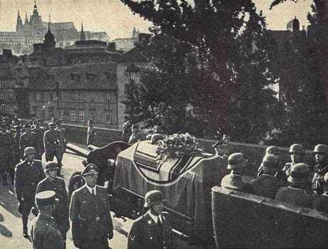 PRAGUE, PROTECTORATE OF BOHEMIA AND MORAVIA - JUNE 7, 1942: An elaborate funeral held in Prague on 7 June 1942, Heydrich's coffin on gun carriage. The train of mourners goes over the Charles bridge in Prague.
