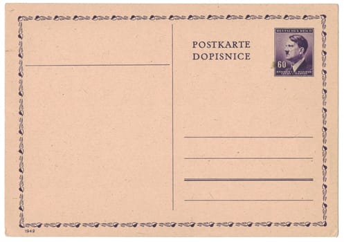 GERMANY (PROTECTORATE OF BOHEMIA AND MORAVIA) - CIRCA 1942: Old postal card with printed post stamp shows portrait of Adolf Hitler (politician, leader of Nazi Party, dictator, veteran of World War), violet, circa 1942