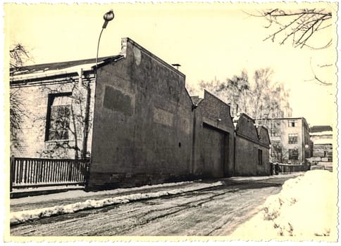 FRAUREUTH, EAST GERMANY - FEBRUARY 1965: The retro photo shows old industry zone in former East Germany.