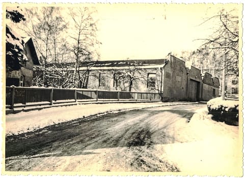 FRAUREUTH, EAST GERMANY - FEBRUARY 1965: The retro photo shows old industry zone in former East Germany. Black and white photo.